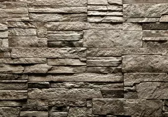 Wall Mural Brown stone - background with irregular texture of stone blocks Wallpaper Cropper