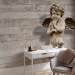 Wall Mural Cherub - sculpture of a cute angel on a retro concrete background 64500 additionalThumb 4