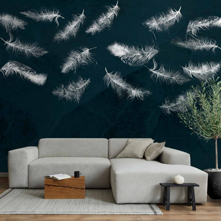 Photo Wallpaper In flight - white feathers carried by the wind on a dark blue background with pattern 142640