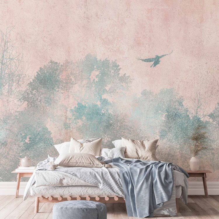 Wall Mural Tree crowns in a forest - blue trees and a flying bird on a soft background 144670 additionalImage 2