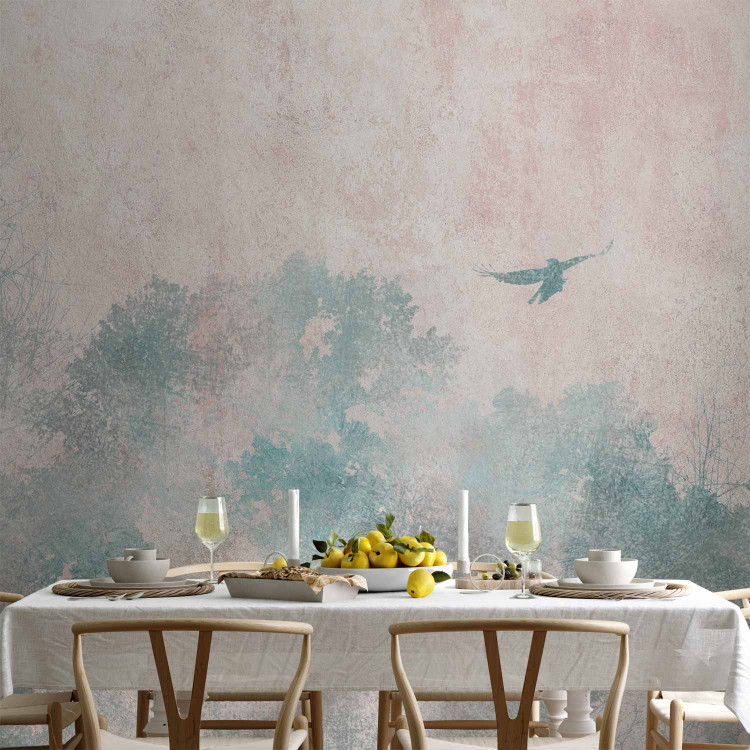 Wall Mural Tree crowns in a forest - blue trees and a flying bird on a soft background 144670 additionalImage 6