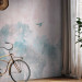 Wall Mural Tree crowns in a forest - blue trees and a flying bird on a soft background 144670 additionalThumb 7