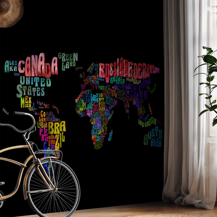 Wall Mural Colourful Journeys - World Map with Colourful Text on a Black Background 59990 additionalImage 4