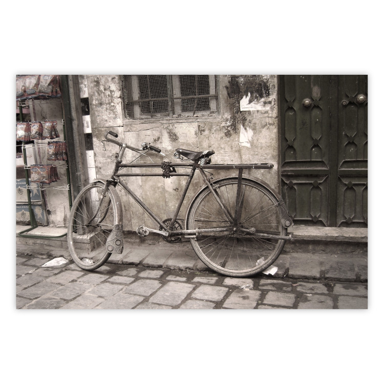 Wall Poster Two-Wheeler - urban scene of a stone street with a vintage-style bicycle 116701