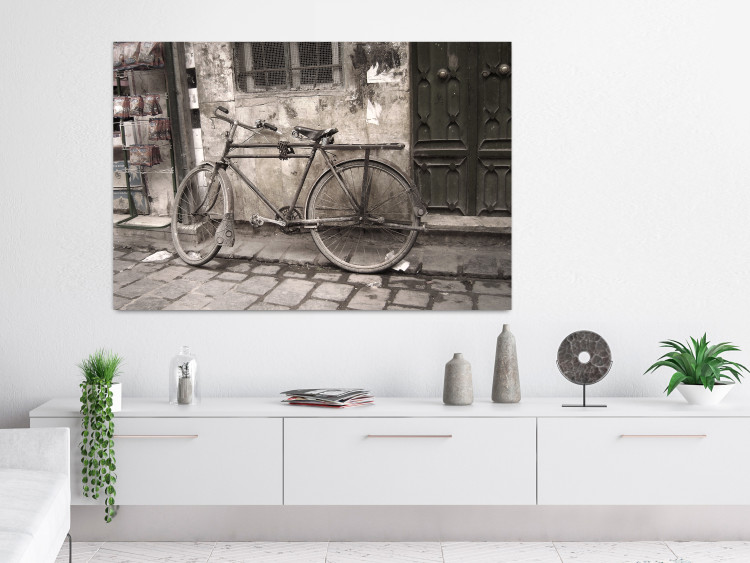 Wall Poster Two-Wheeler - urban scene of a stone street with a vintage-style bicycle 116701 additionalImage 17