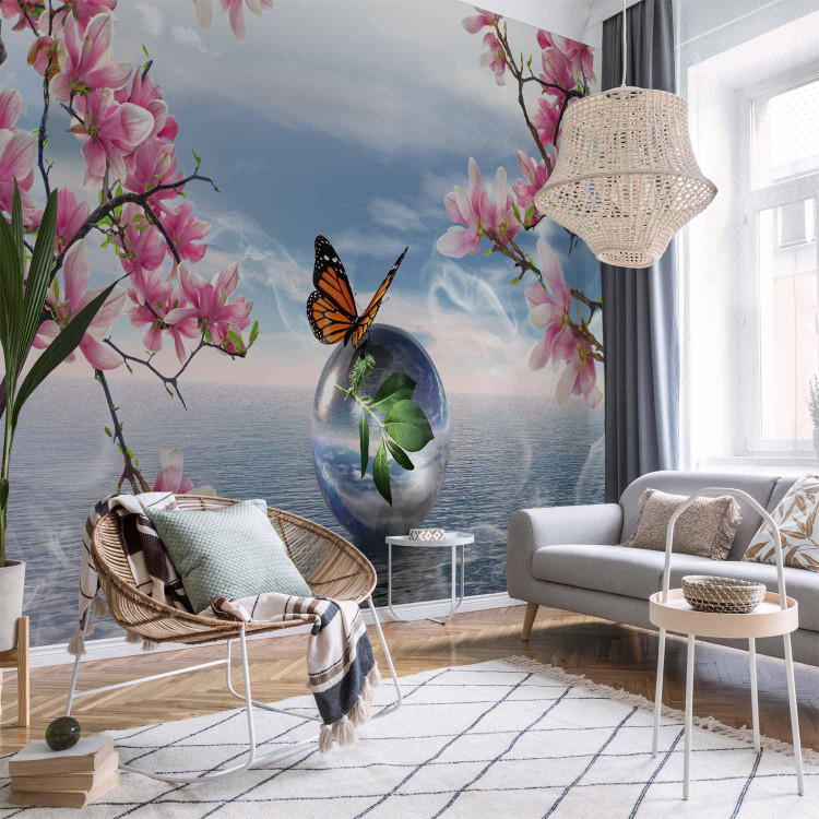 Wall Mural Butterfly Fantasy - Butterfly on a ball against the sea and magnolia background 61301