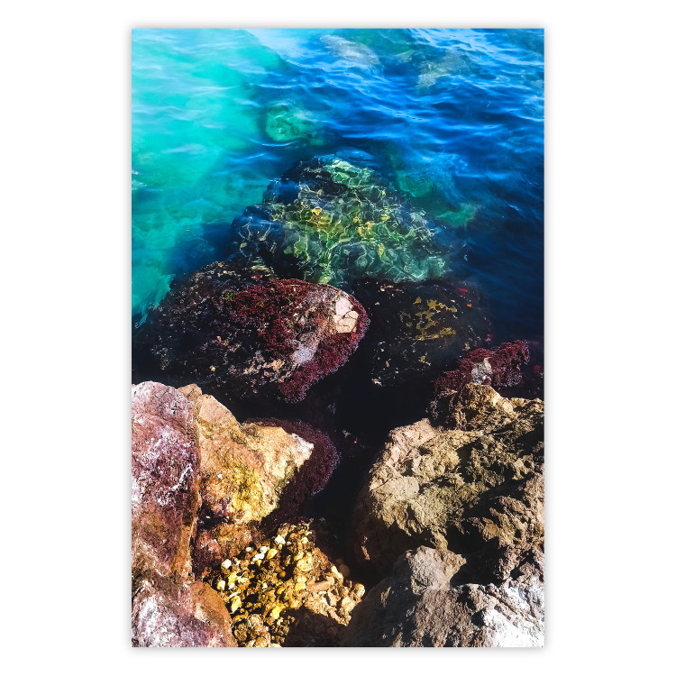 Poster Rocky Shore of the Sea - Photo of Colored Stones and Blue Water 146241