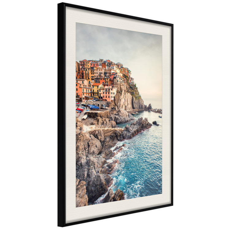 Wall Poster Magical Harbor - landscape of architecture on cliffs against the ocean 130451 additionalImage 2