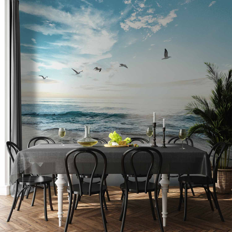 Wall Mural Abandoned beach - seascape with waves, birds and a setting sun 138461 additionalImage 6