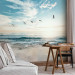 Wall Mural Abandoned beach - seascape with waves, birds and a setting sun 138461 additionalThumb 4
