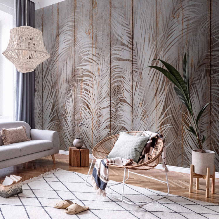 Wall Mural Beige Exotic - White Palm Leaves on the Background of Light Boards 147661