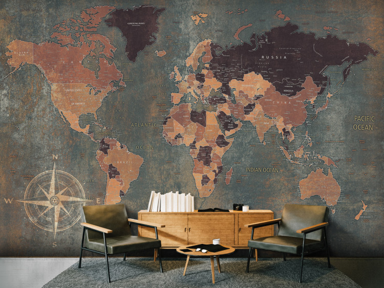 Wall Mural World in green - map of the continents on a non-uniform background with a compass 91661