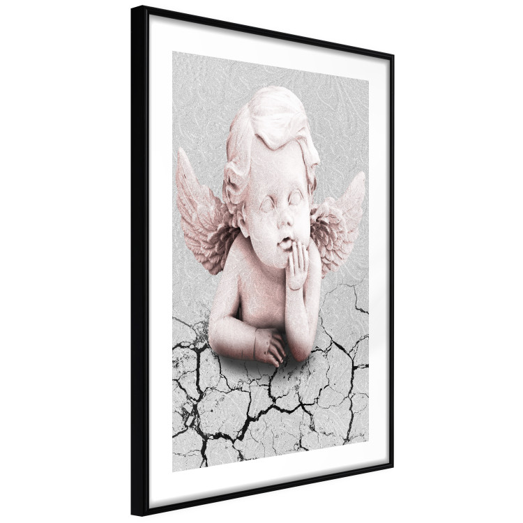 Poster Angel - light pink figurine of a boy leaning on gray cracked earth 116791 additionalImage 11