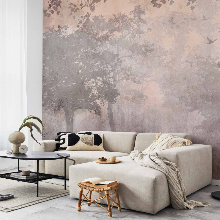 Wall Mural Pink dawn - subtle landscape of a misty forest with trees and birds 142691