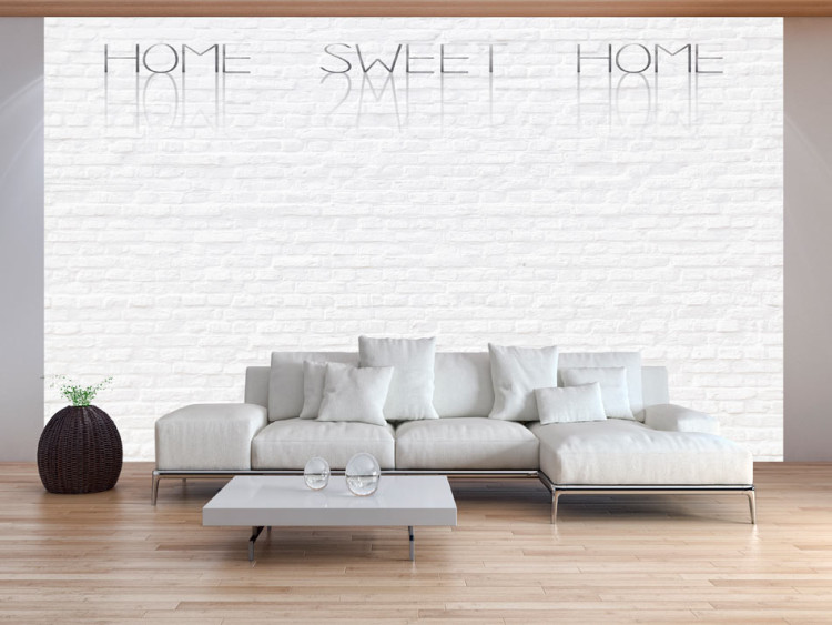 Photo Wallpaper Home Sweet Home - Beige Text on White Brick with Shadow and Reflection 60891
