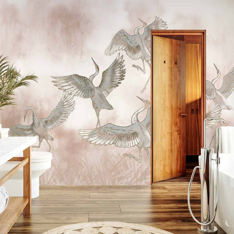 Wall Mural Dancing herons - illustration of birds in dynamic poses on an abstract background in powder pink 138402 additionalImage 8