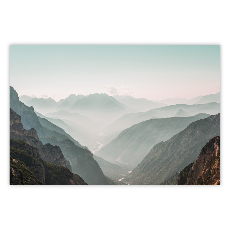 Poster Mountain Horizon - landscape of rocky mountains with a gentle misty glow 129842