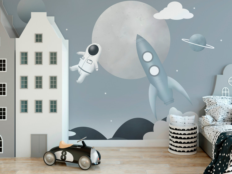 Wall Mural Astronaut in Space - Rocket and Planets in the Gray-Blue Sky 148442