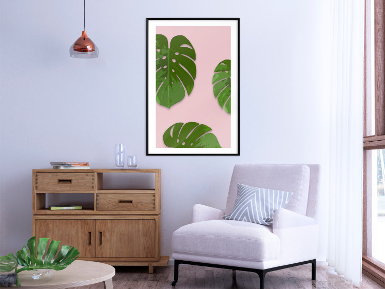 Wall Poster Fragment of Exoticism - tropical green monstera leaves on a pink background 127062 additionalImage 14