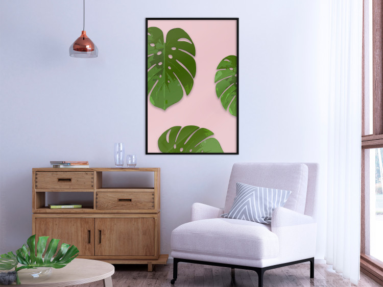 Wall Poster Fragment of Exoticism - tropical green monstera leaves on a pink background 127062 additionalImage 4