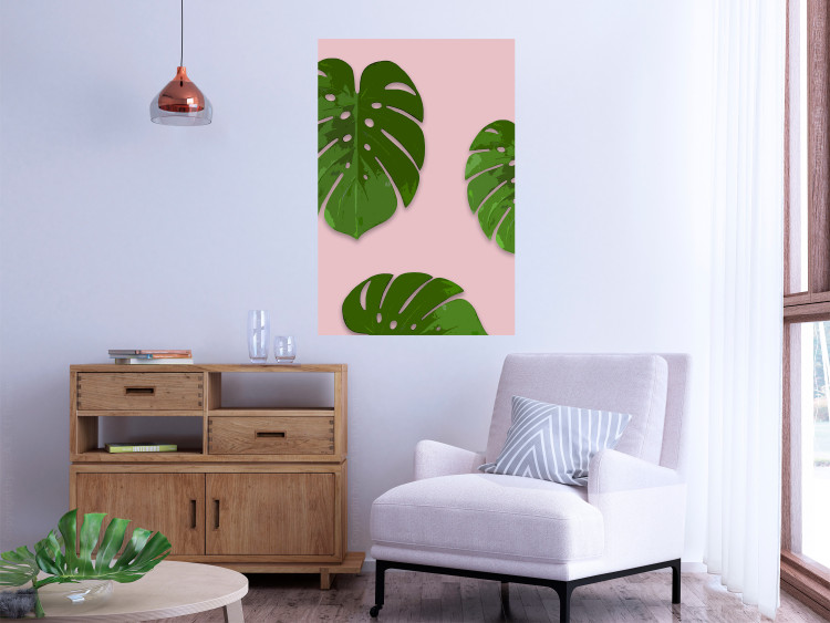 Wall Poster Fragment of Exoticism - tropical green monstera leaves on a pink background 127062 additionalImage 2