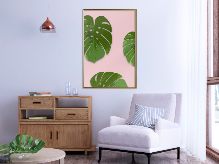 Wall Poster Fragment of Exoticism - tropical green monstera leaves on a pink background 127062 additionalImage 5