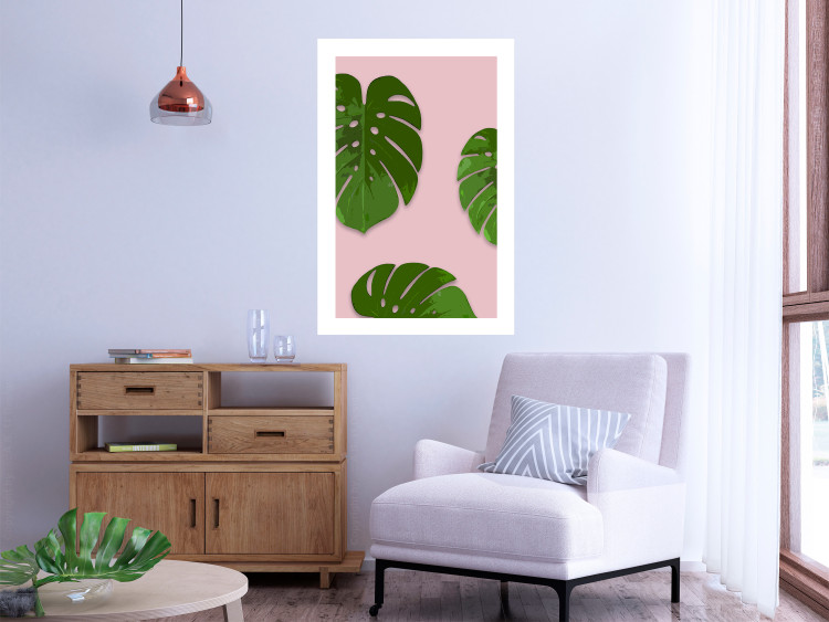 Wall Poster Fragment of Exoticism - tropical green monstera leaves on a pink background 127062 additionalImage 3
