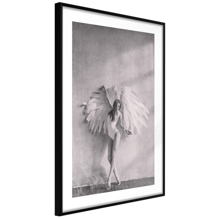 Poster Winged - black and white woman with large wings against a concrete background 134182 additionalImage 4
