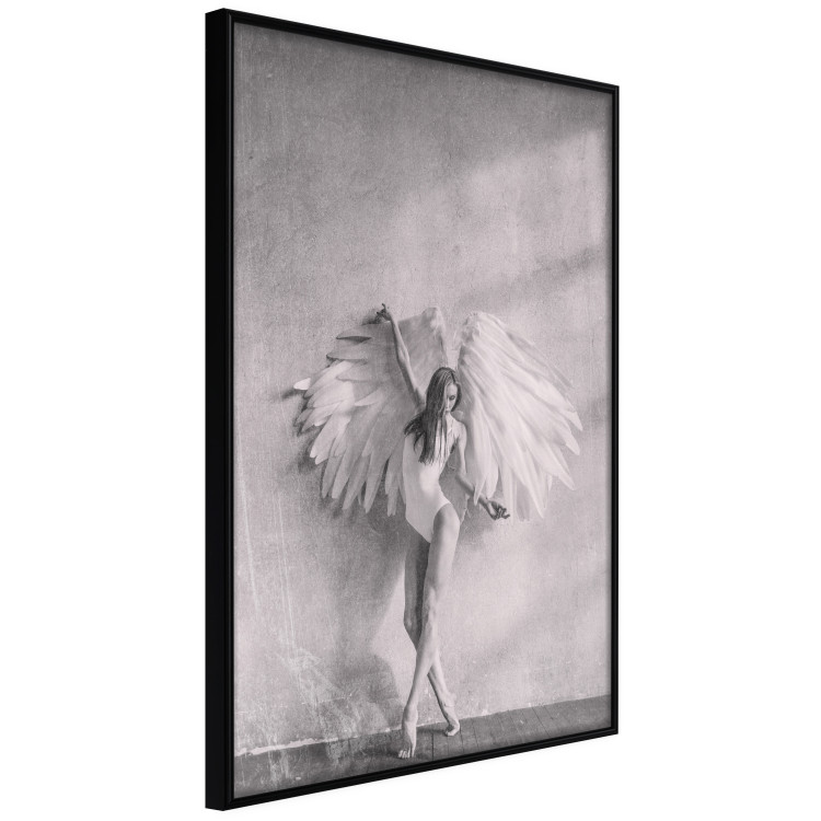 Poster Winged - black and white woman with large wings against a concrete background 134182 additionalImage 11