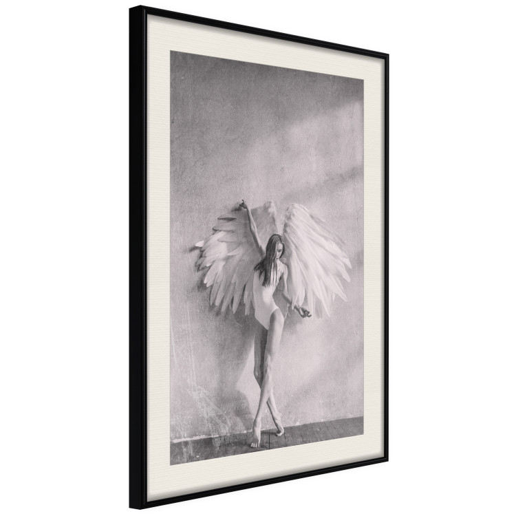 Poster Winged - black and white woman with large wings against a concrete background 134182 additionalImage 3