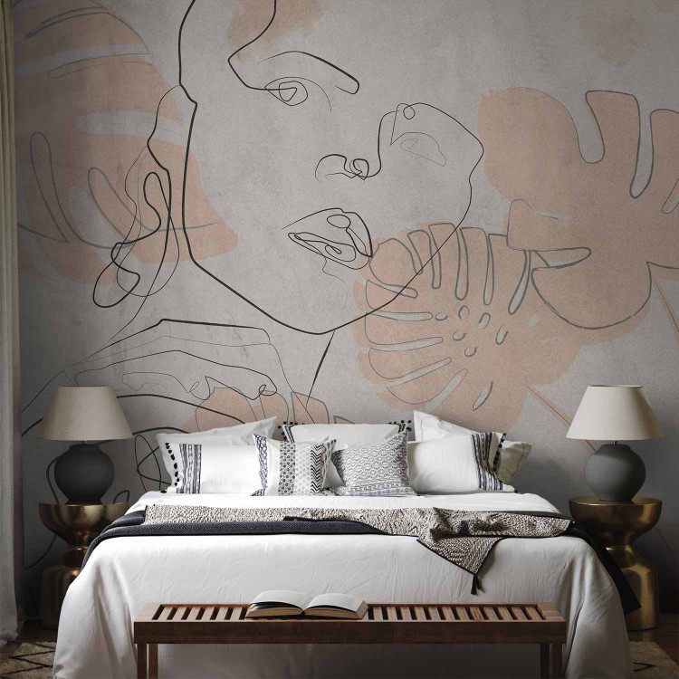 Wall Mural Delicate abstraction - outline of a woman's face on a background with pink leaves 134173 additionalImage 2