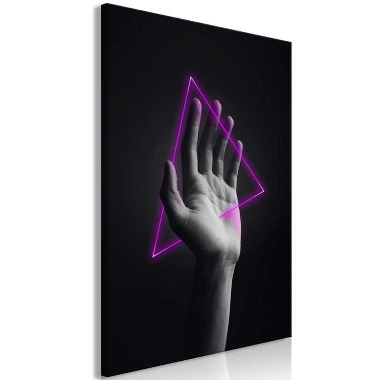 Canvas Print Triangle in hand - neon figure in the hand on black background 125083 additionalImage 2