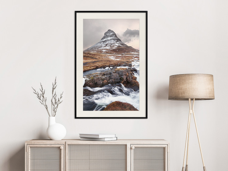 Wall Poster Kirkjufell - winter landscape of a mountain and a stream against the sky 130383 additionalImage 18