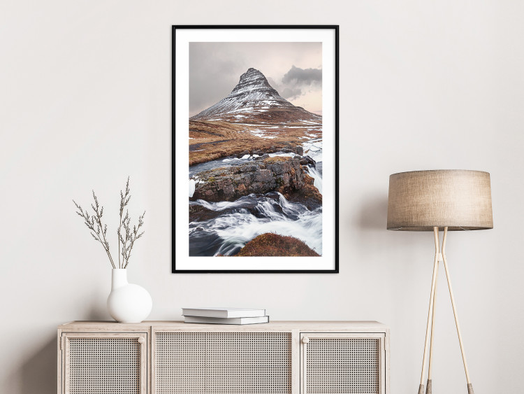 Wall Poster Kirkjufell - winter landscape of a mountain and a stream against the sky 130383 additionalImage 20