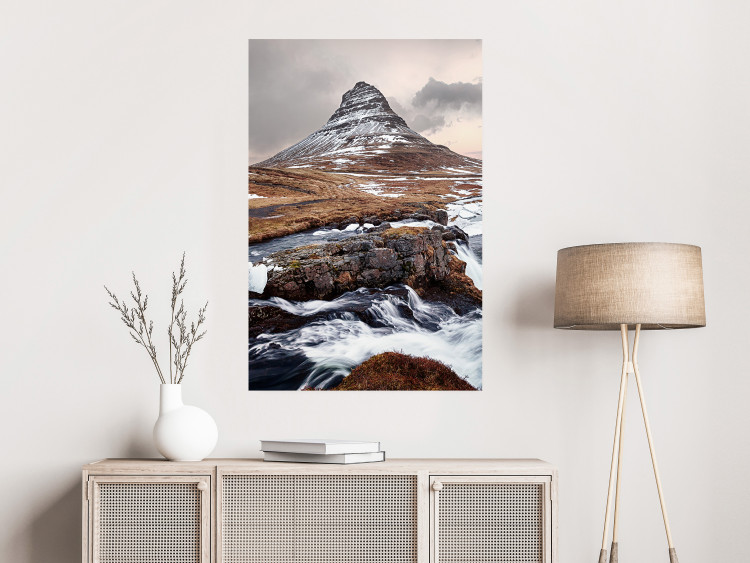 Wall Poster Kirkjufell - winter landscape of a mountain and a stream against the sky 130383 additionalImage 2