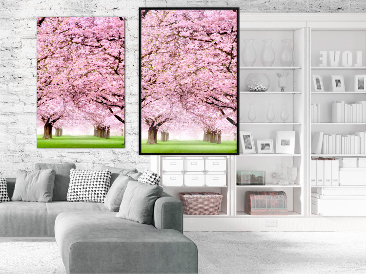 Wall Poster Cherry Orchard - landscape of green grass and trees with pink leaves 126214 additionalImage 3