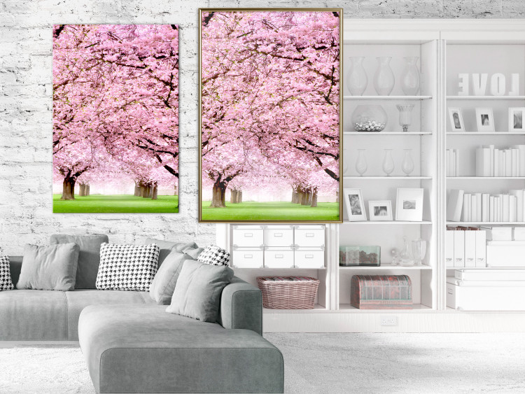 Wall Poster Cherry Orchard - landscape of green grass and trees with pink leaves 126214 additionalImage 5
