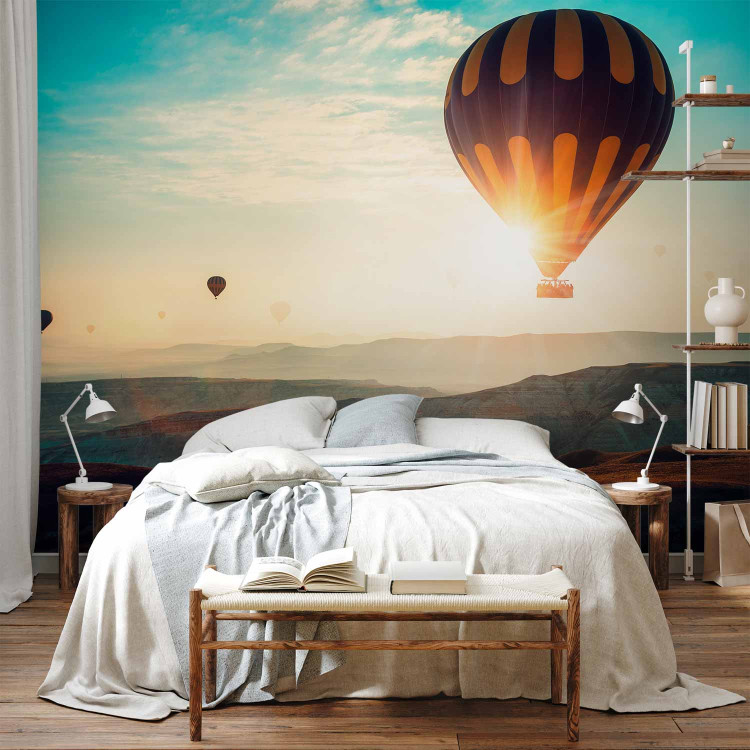 Wall Mural Balloon flight - landscape of balloons soaring into the sky over mountains 143124 additionalImage 2