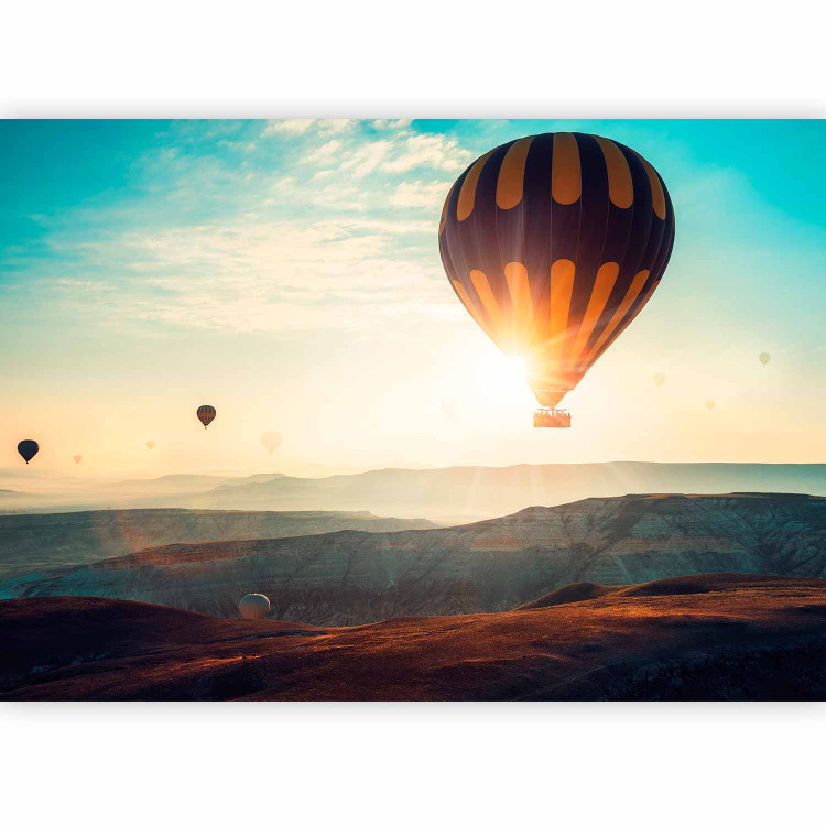 Wall Mural Balloon flight - landscape of balloons soaring into the sky over mountains 143124 additionalImage 1