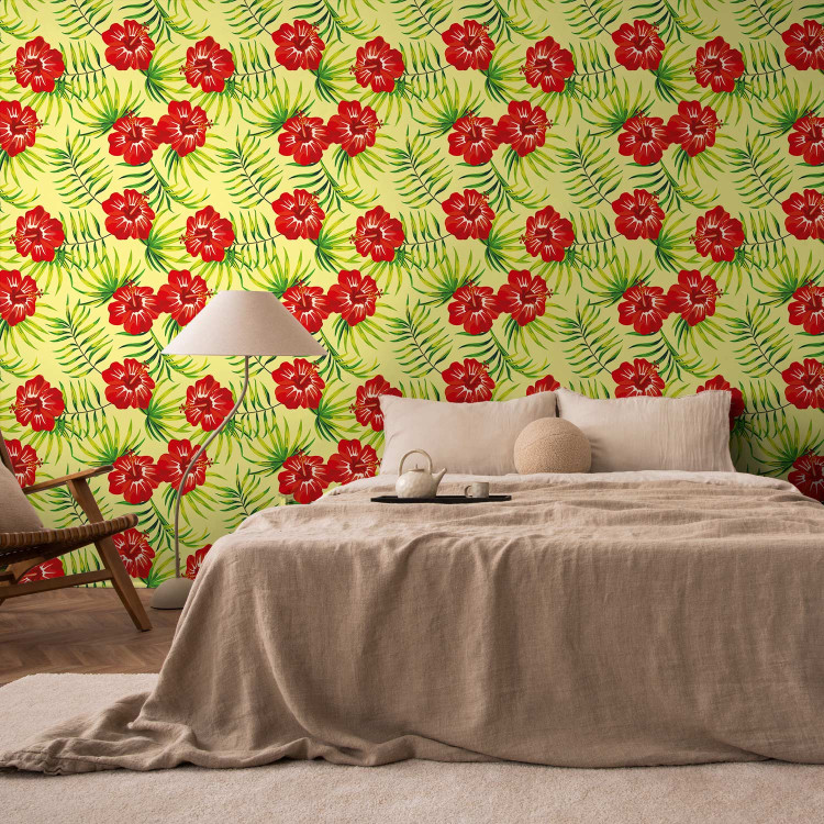 Modern Wallpaper Fiery Hibiscus - Red Flowers and Green Leaves on a Yellow Background 150034