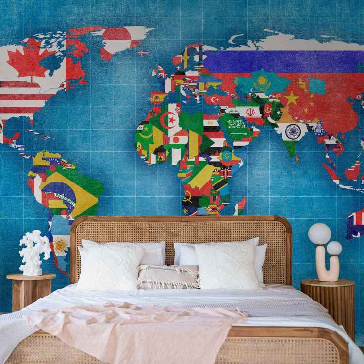 Wall Mural World map - motif of continents in flag colours on a blue background 96764 additionalImage 2