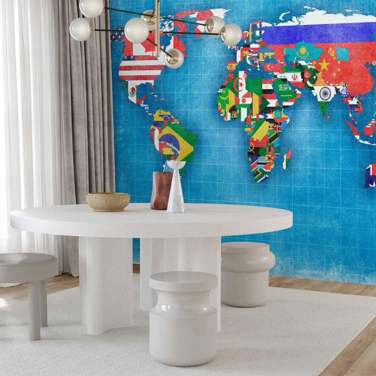 Wall Mural World map - motif of continents in flag colours on a blue background 96764 additionalImage 4