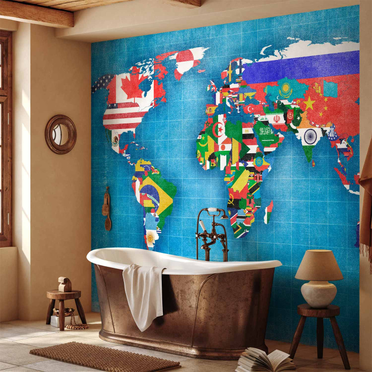 Wall Mural World map - motif of continents in flag colours on a blue background 96764 additionalImage 8
