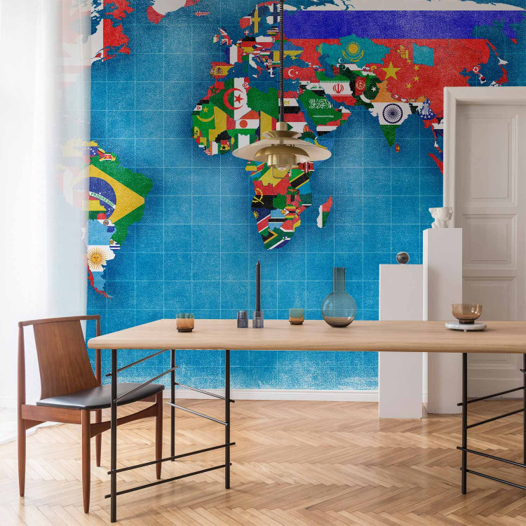 Wall Mural World map - motif of continents in flag colours on a blue background 96764 additionalImage 6