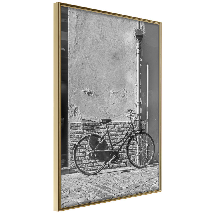 Wall Poster Old Italian Bicycle - black and white shot with a view of a stone street 117784 additionalImage 14