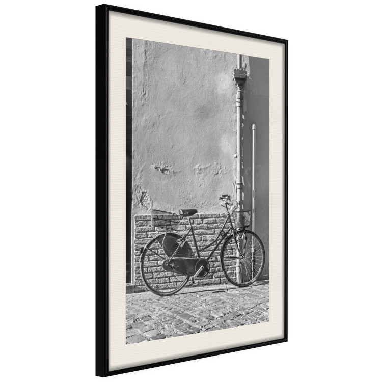 Wall Poster Old Italian Bicycle - black and white shot with a view of a stone street 117784 additionalImage 3