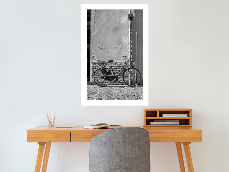 Wall Poster Old Italian Bicycle - black and white shot with a view of a stone street 117784 additionalImage 2