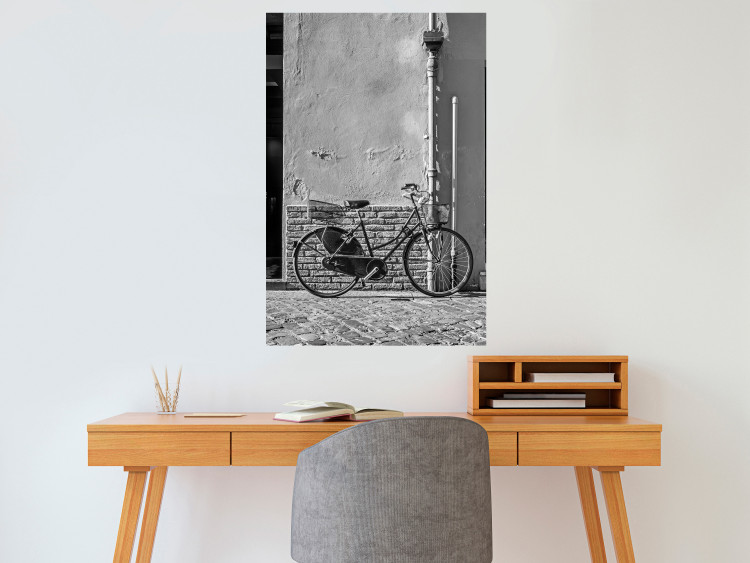 Wall Poster Old Italian Bicycle - black and white shot with a view of a stone street 117784 additionalImage 23
