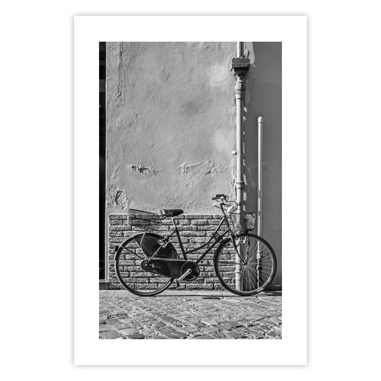 Wall Poster Old Italian Bicycle - black and white shot with a view of a stone street 117784 additionalImage 25