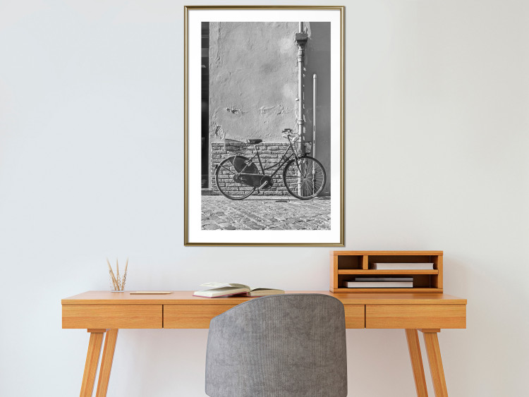 Wall Poster Old Italian Bicycle - black and white shot with a view of a stone street 117784 additionalImage 15